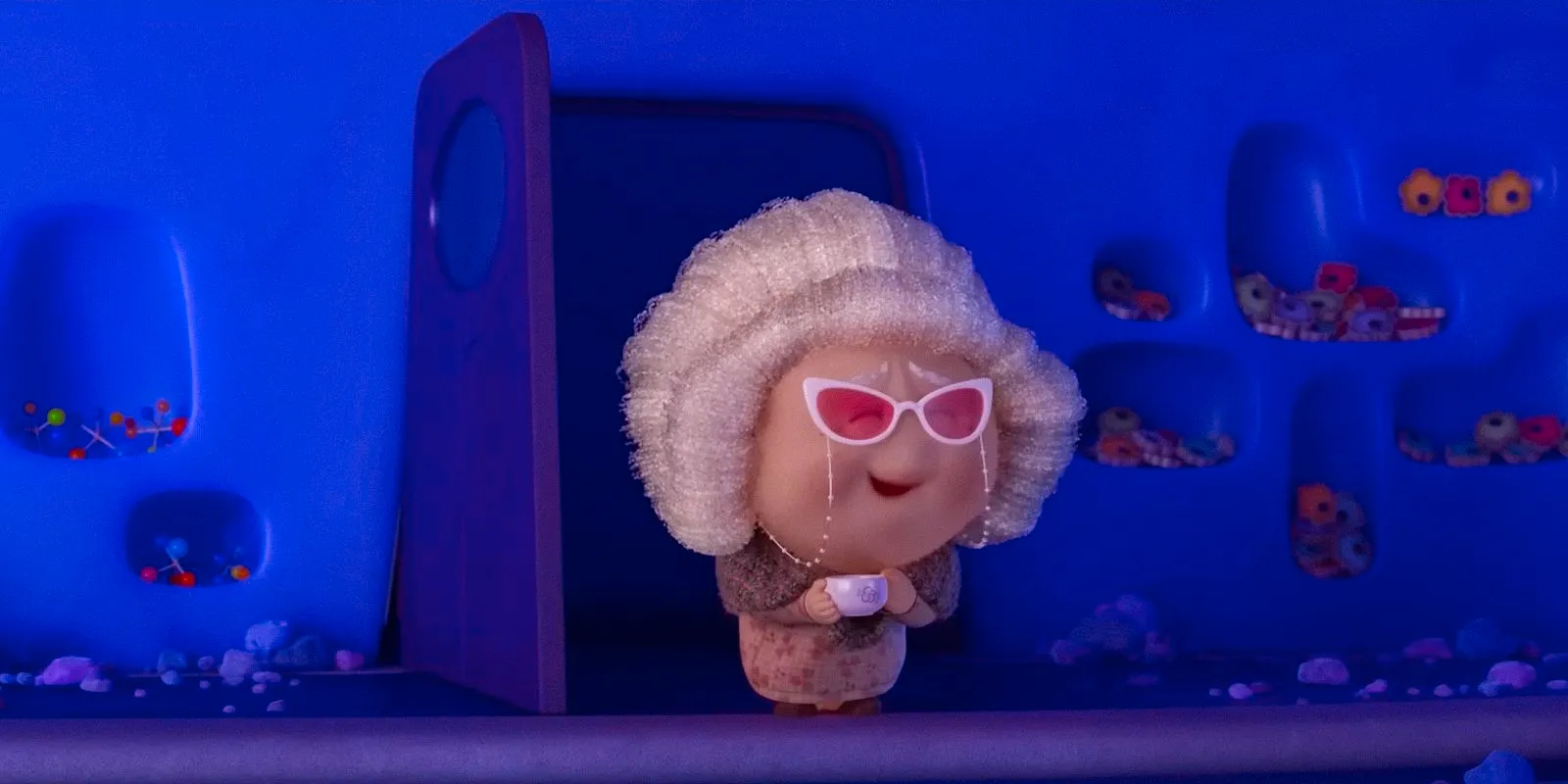 Nostalgia as an old lady with a bun and pink glasses, holding a teacup in Inside Out 2 Image