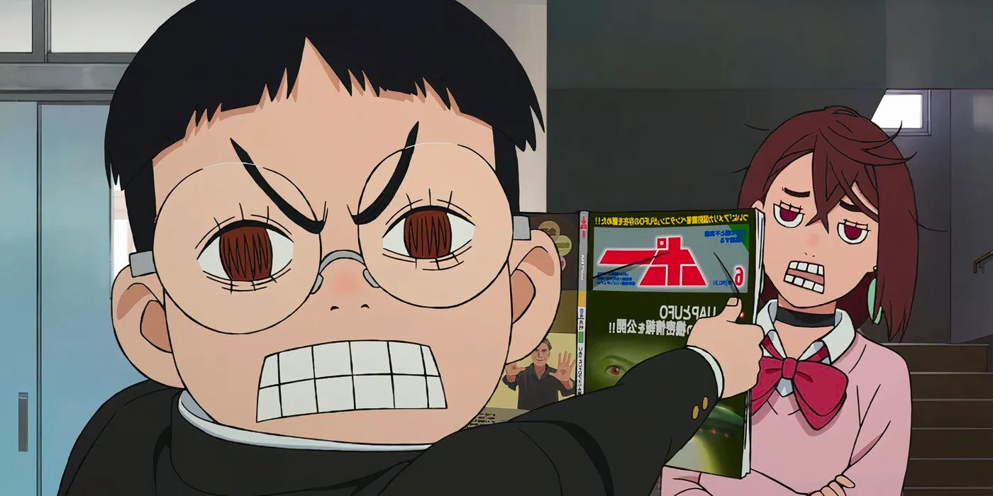 Okarun showing a magazine to Momo in the Dan Da Dan anime. Image