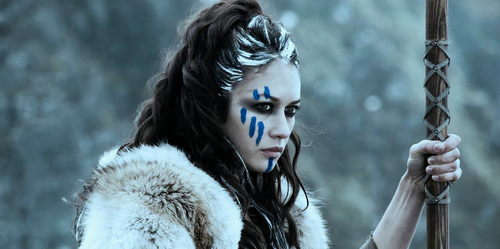 Olga Kurylenko as a warrior with face paint in Centurion Image