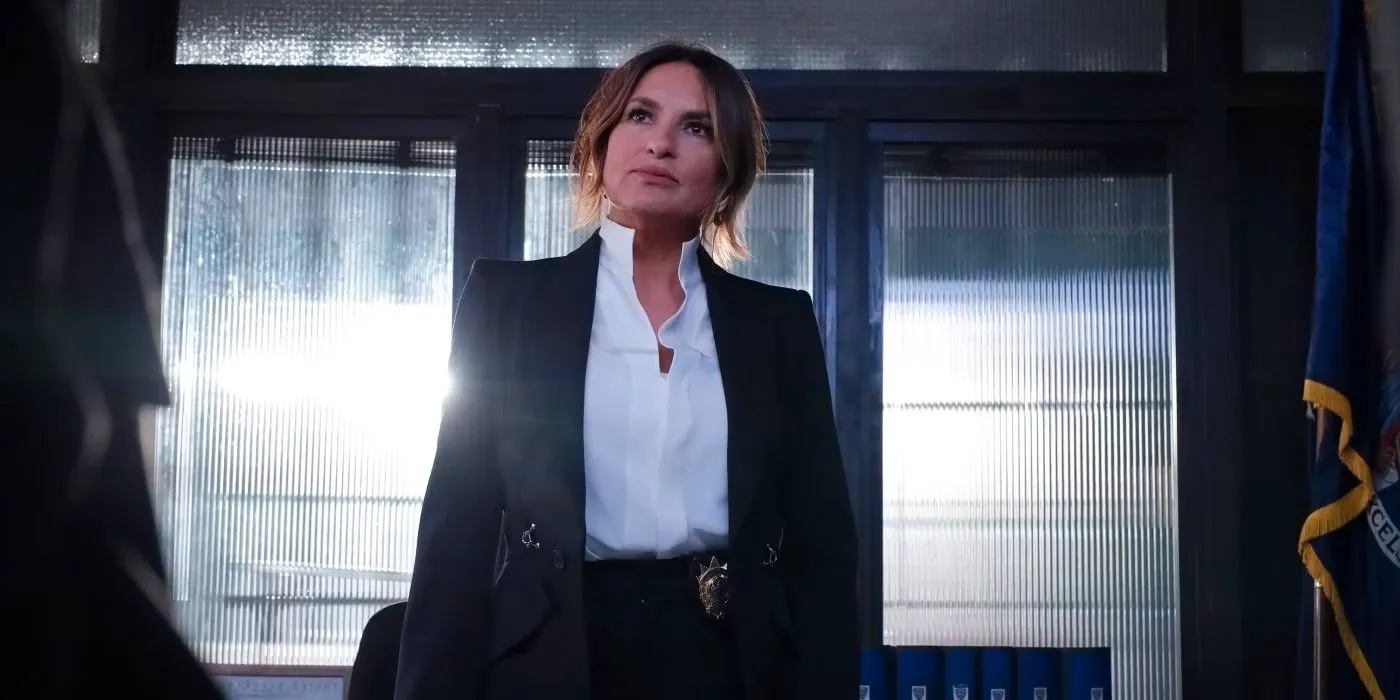 Olivia Benson standing at her desk with light coming in behind her in the episode Gimme Shelter Image