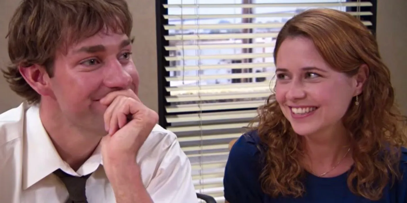 Pam and Jim giggling and smiling together on The Office Image