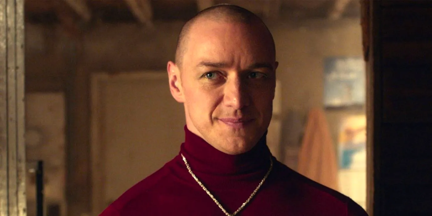 Patricia (James McAvoy) smiling and wearing a red turtleneck shirt in Split Image