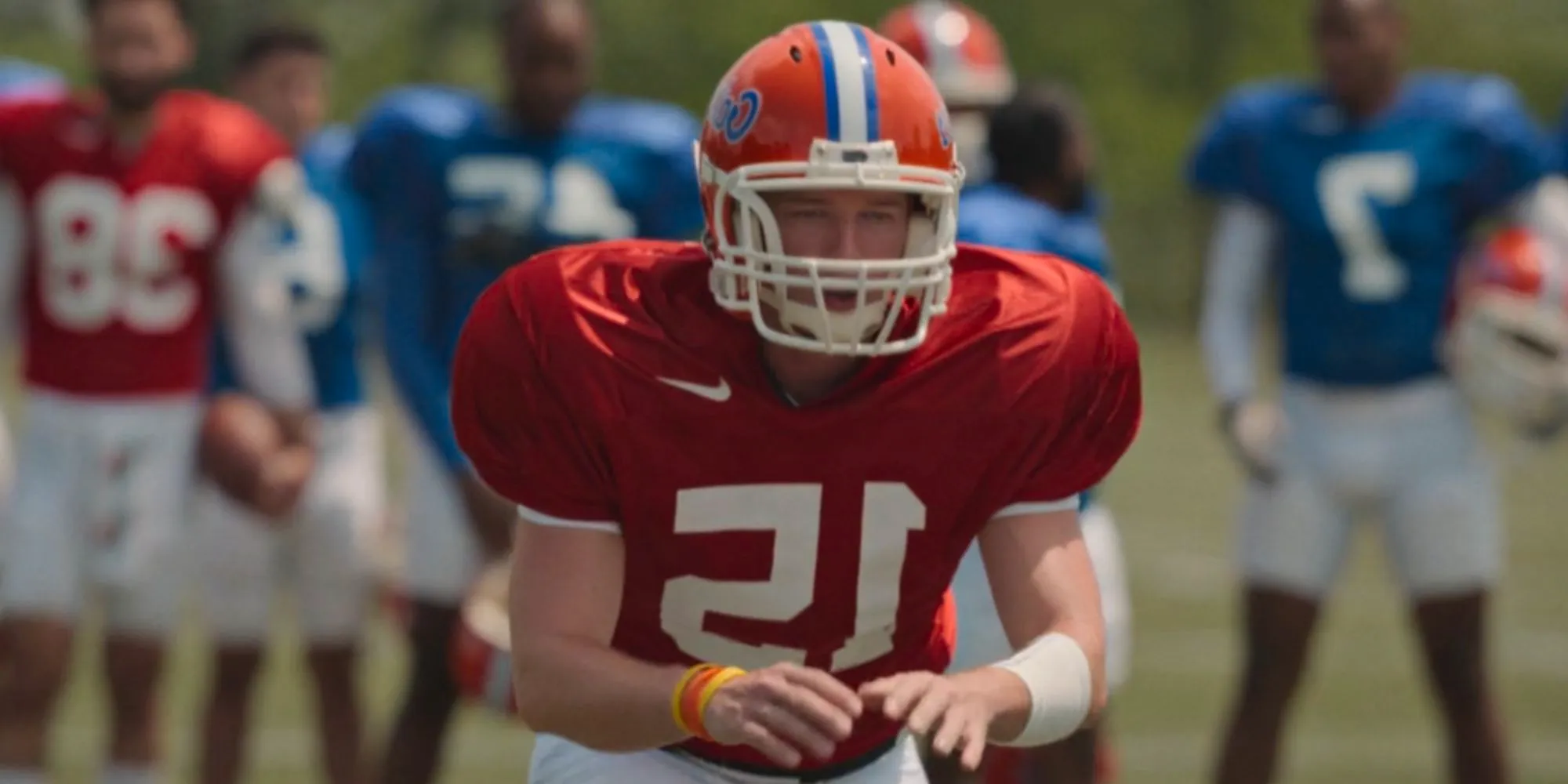 Patrick Schwarzenegger getting ready to receive a snap as Tim Tebow in American Sports Story Image