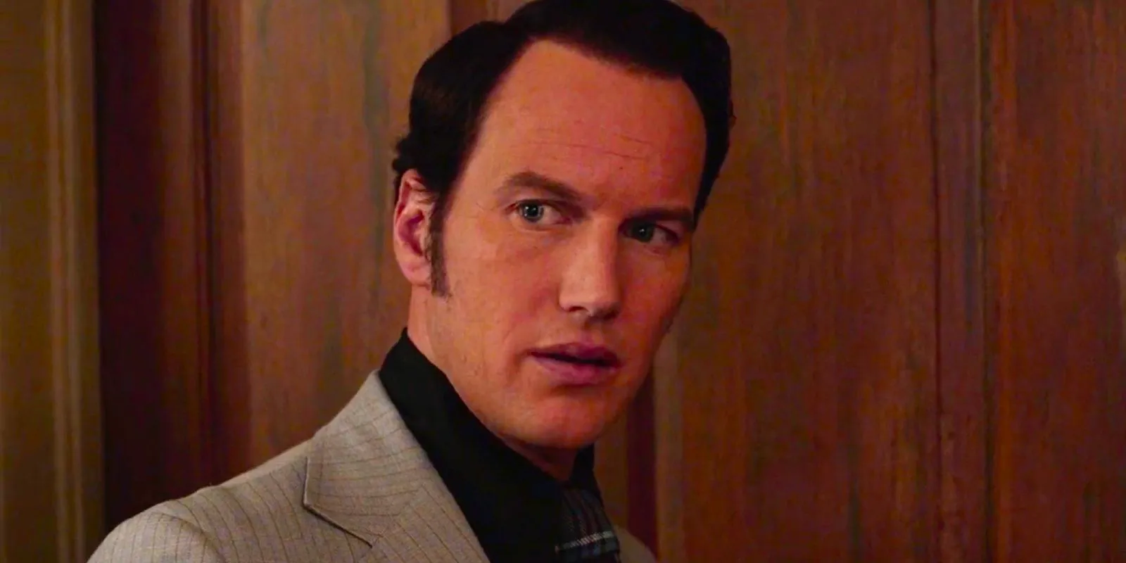 Patrick Wilson as Ed Warren looking concerned in The Conjuring Image