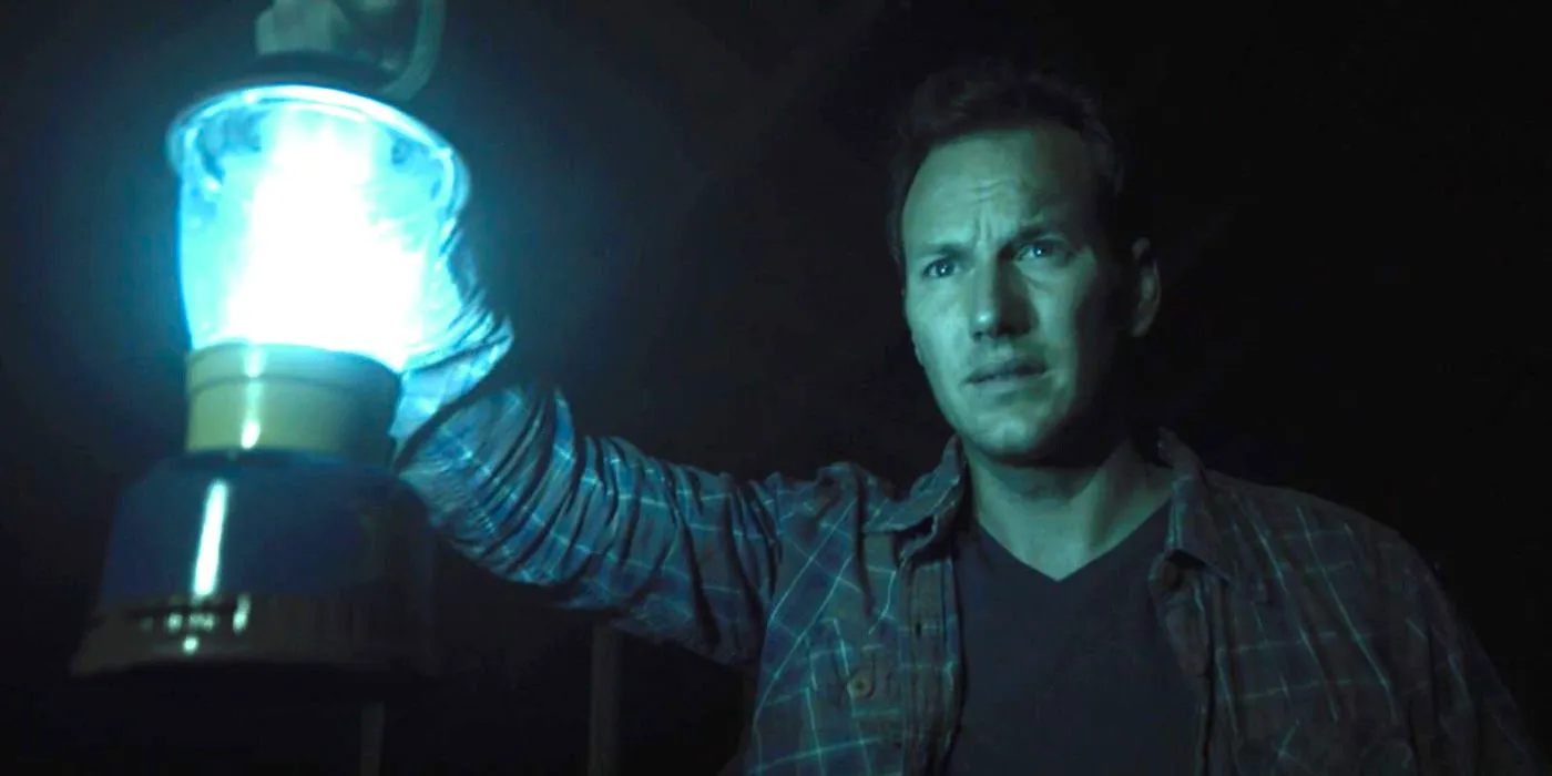 Patrick Wilson holding a lantern in the Further in Insidious Image