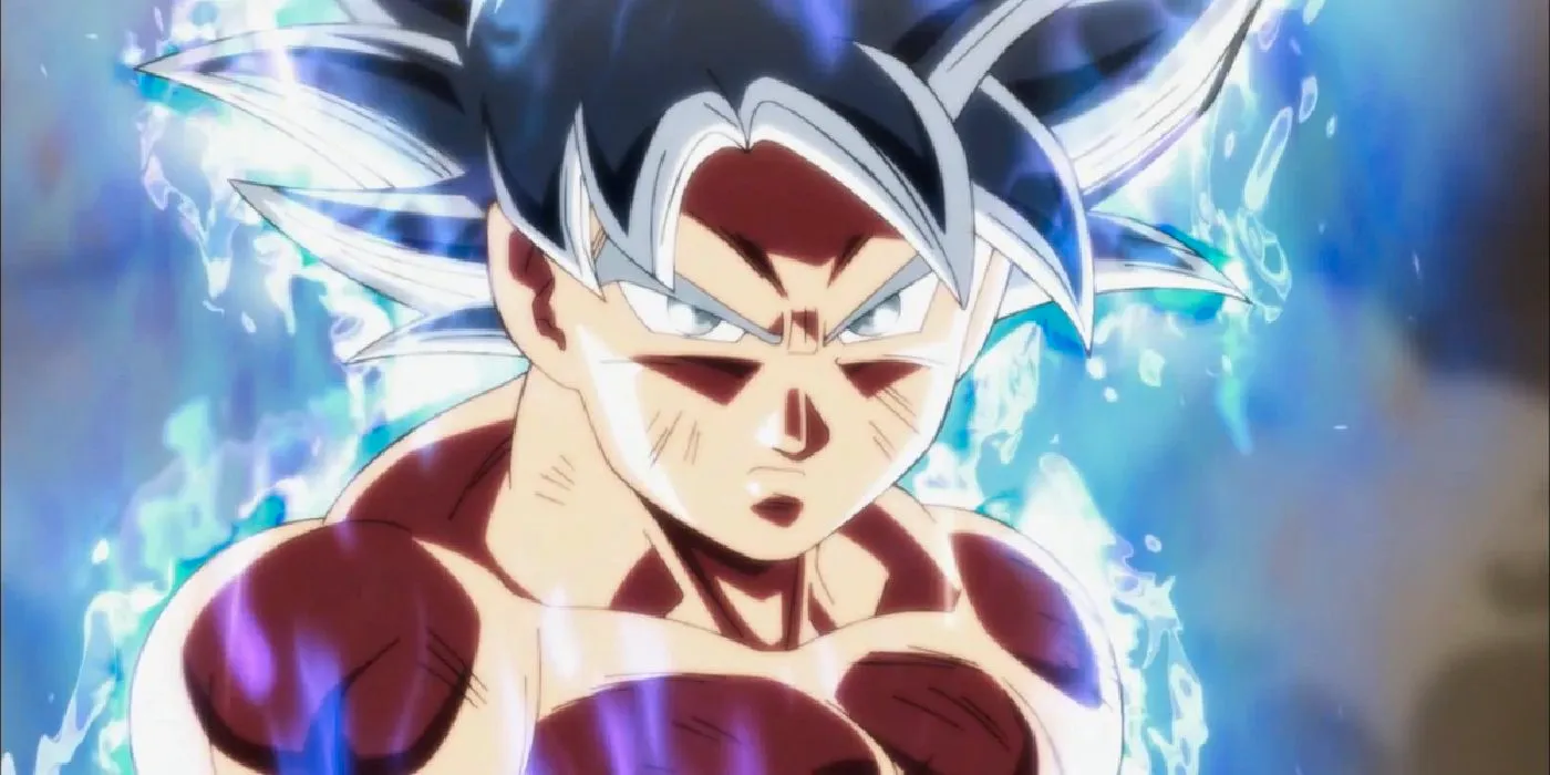 Perfected Ultra Instinct Goku looks serious with an aura of silver energy around him in Dragon Ball Super. Image