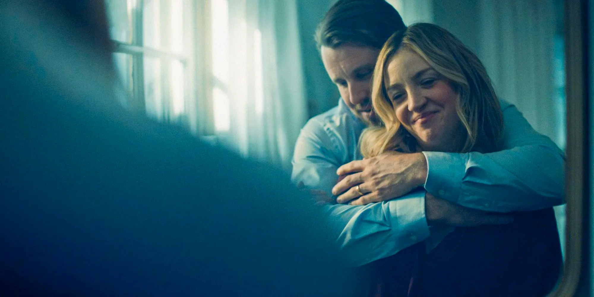 Pete (Chris Witaske) embracing Sugar (Abby Elliott) while they look at themselves in the mirror in The Bear Season 3 Episode 4 Image