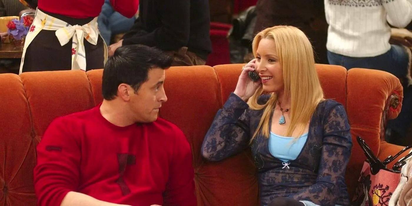 Phoebe talking on the phone and Joey staring at her on the couch in Central Perk in Friends Image