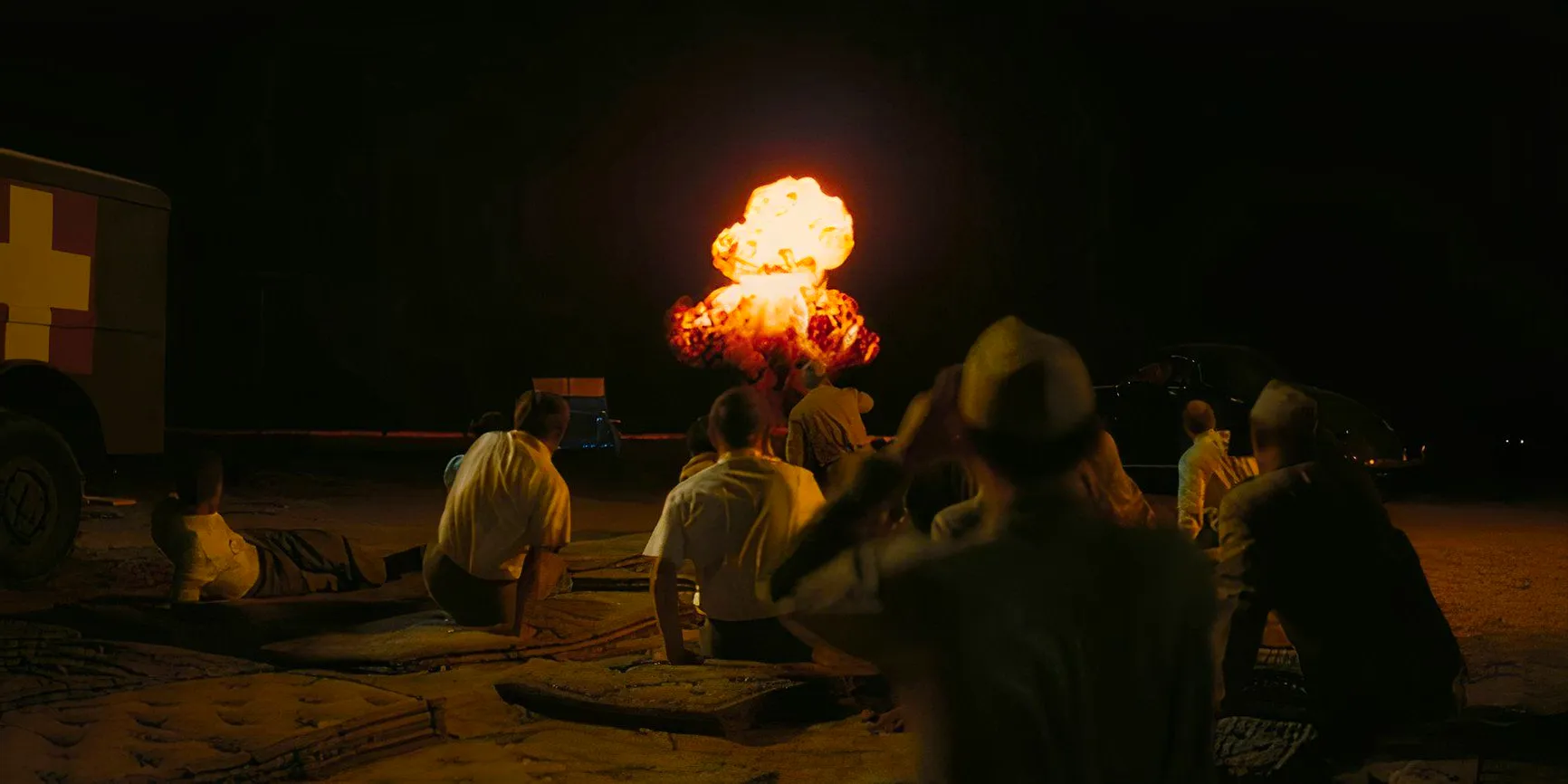 Physicists watching the detonation of the atomic bomb at Los Alamos in Oppenheimer Image