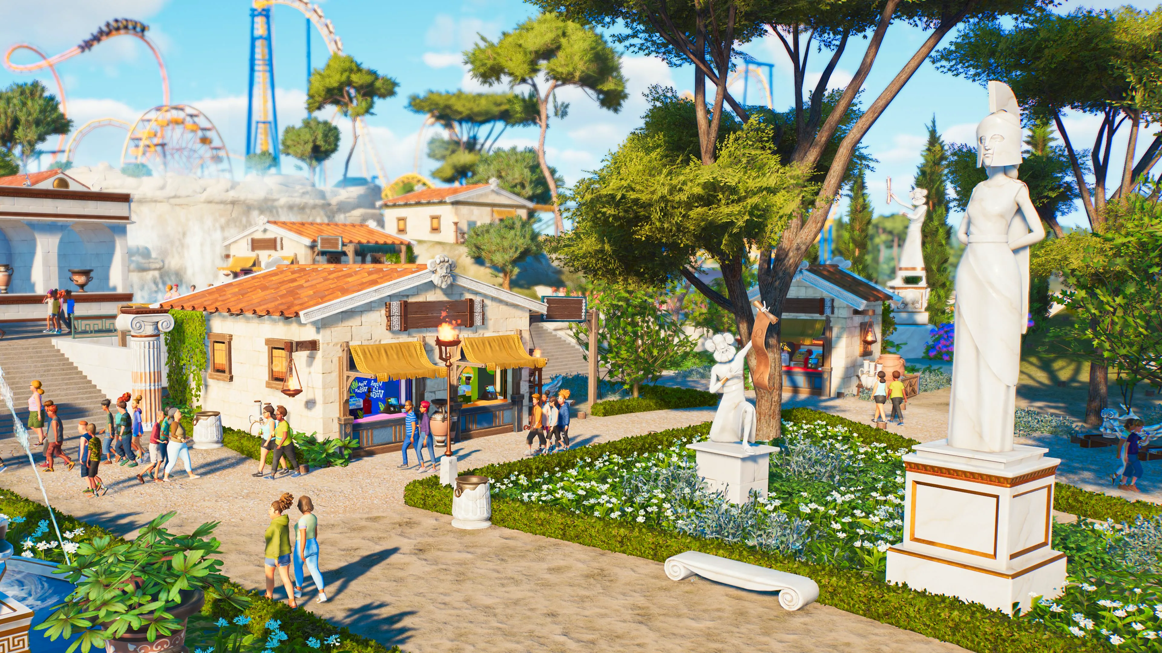 Planet Coaster 2 Mythology Set pieces like Greek statues and pillars placed in the park around food stands as attendees walk by. Image