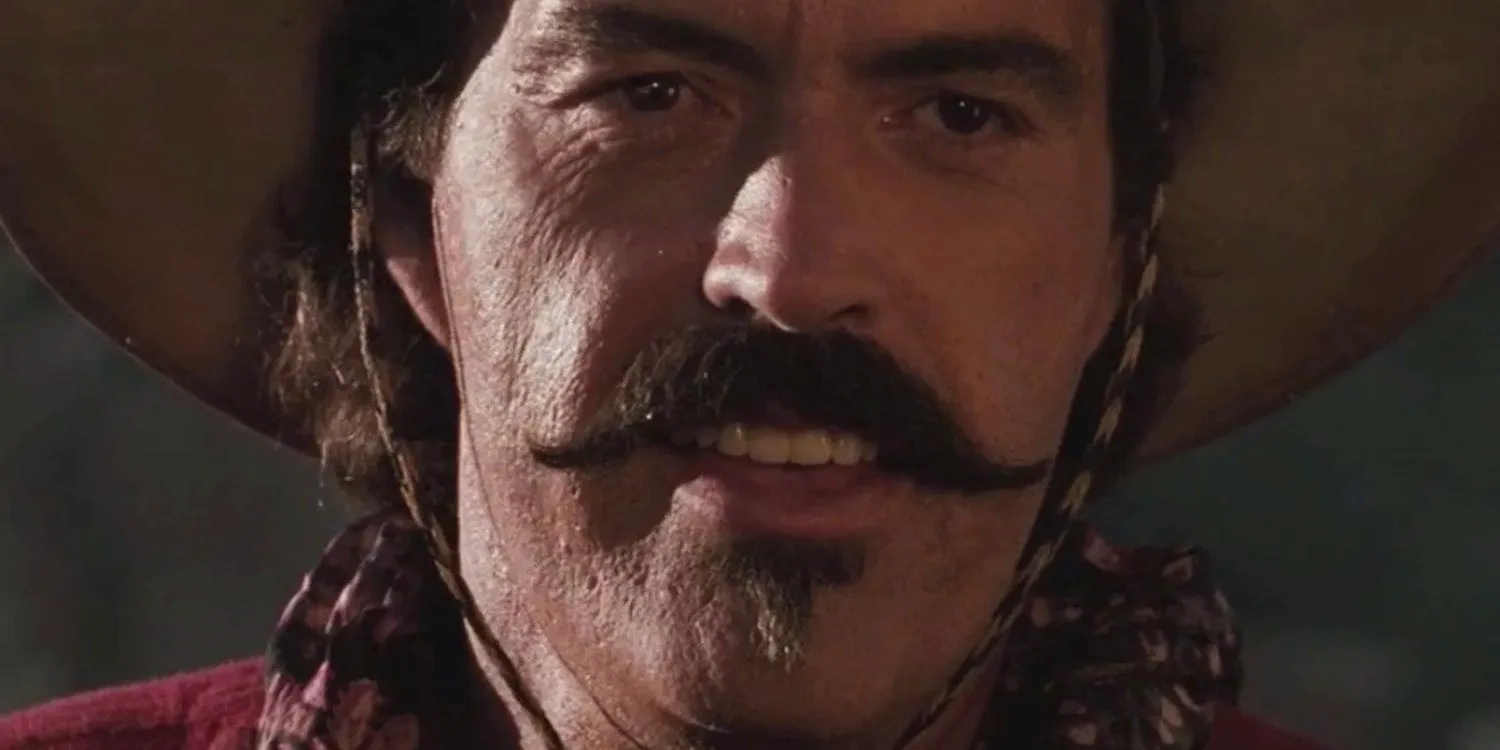 Powers Boothe smirking as William 