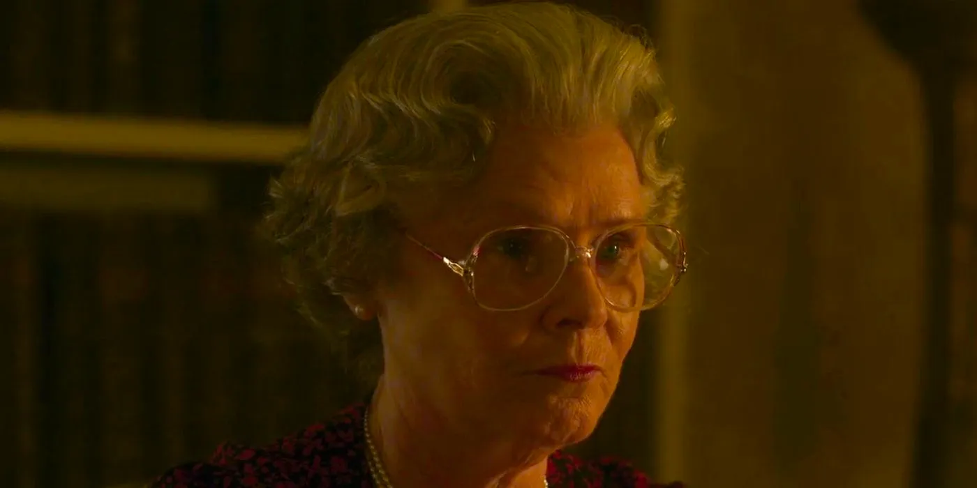 Queen Elizabeth II wearing glasses and speaking in The Crown season 6 episode 8. Image