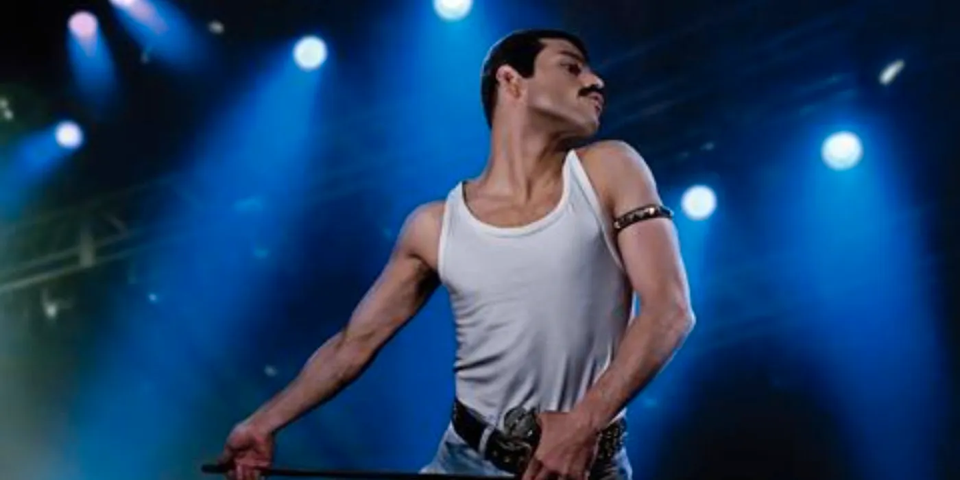 Rami Malek as Freddie Mercury dancing on stage in Bohemian Rhapsody  Image