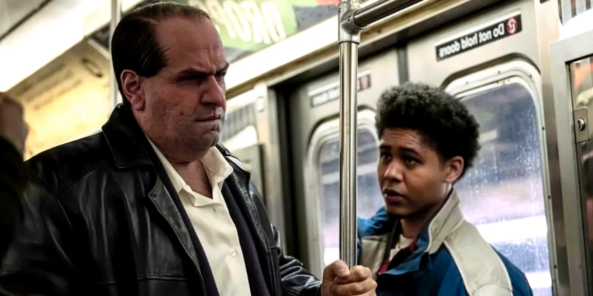 Rhenzy Feliz' Victor Aguilar and Colin Farrell's Os Cobb ride the subway in The Penguin episode 1 Image