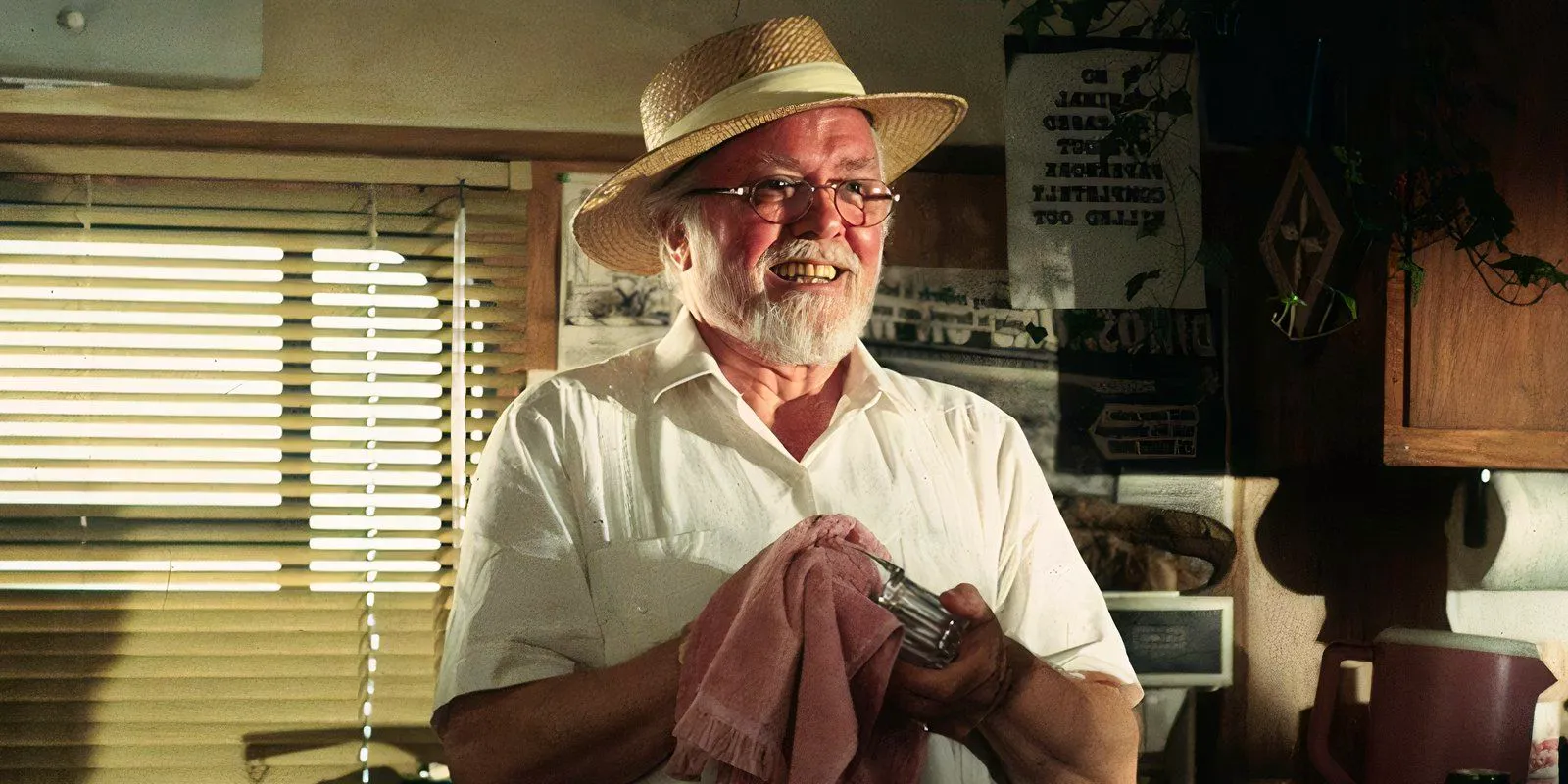 Richard Attenborough cleaning a glass with a rag as John Hammond in Jurassic Park Image