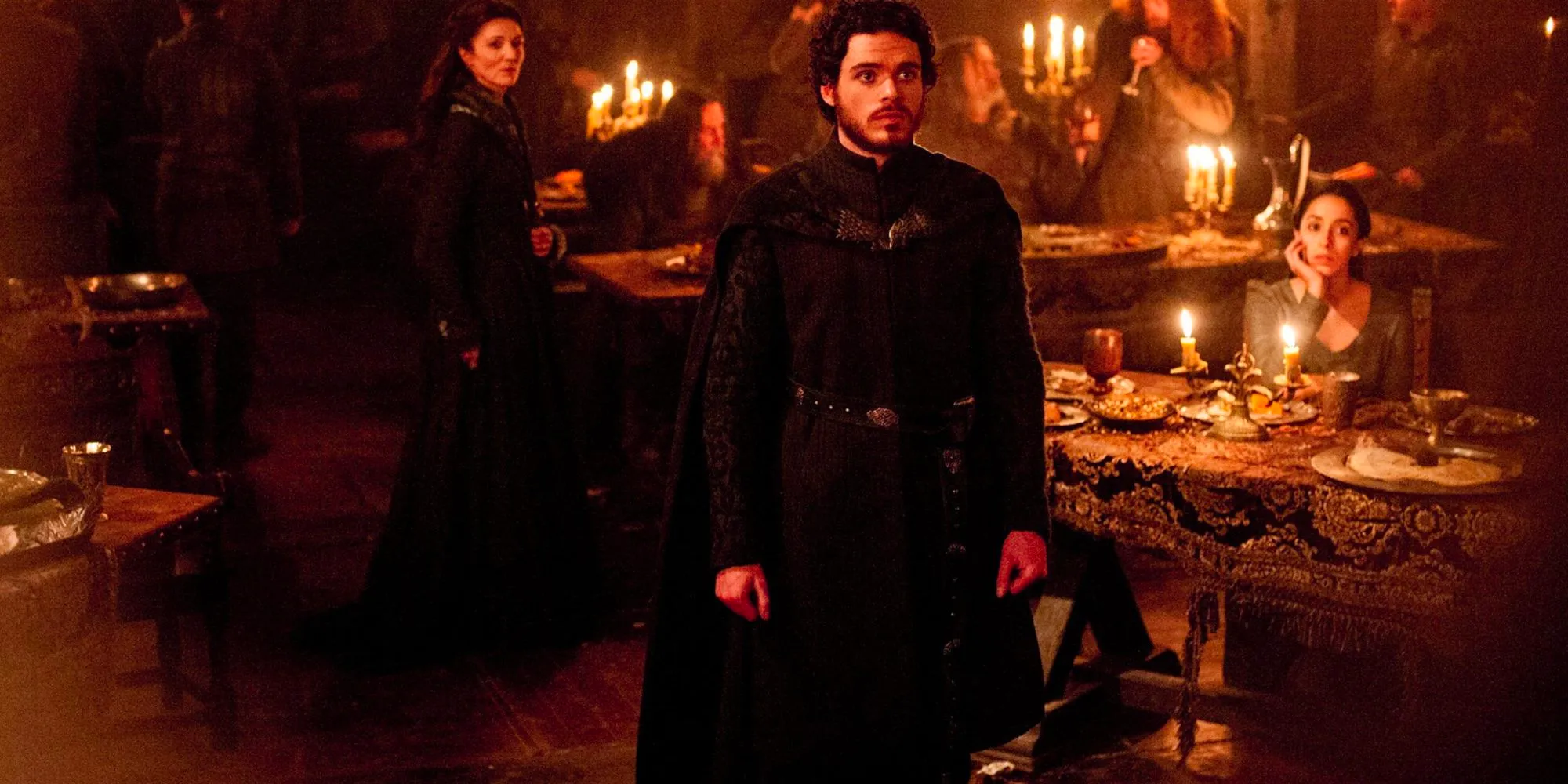 Richard Madden as Robb Stark standing up at The Red Wedding in Game of Thrones Image