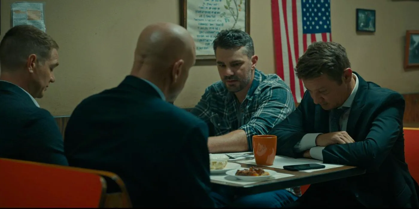 Robert (Hamish Allan-Headley) talking to Mike (Jeremy Renner) and two other officers about the Heart Attack Letter in Mayor of Kingstown. Image