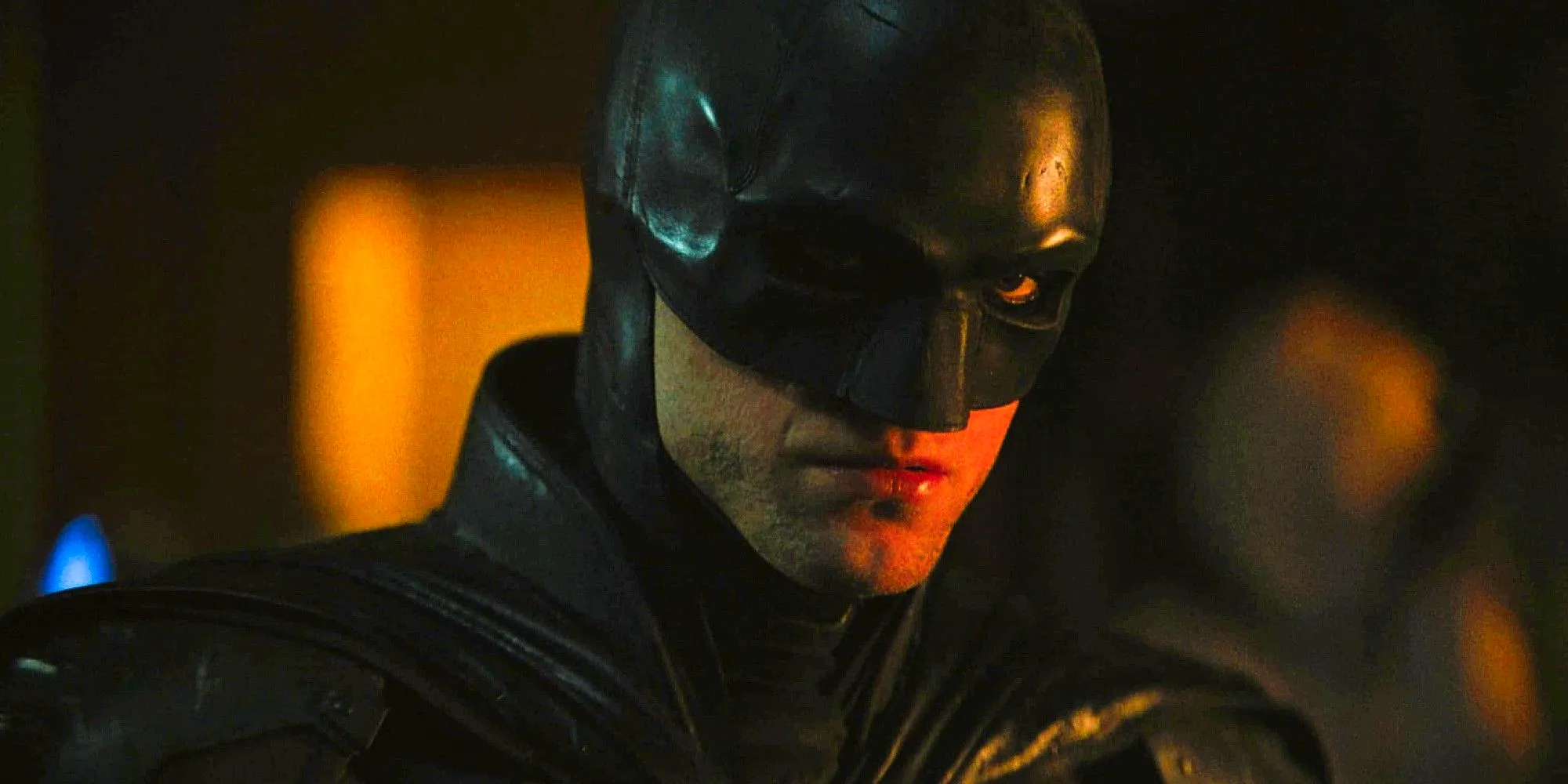 Robert Pattinson as Bruce Wayne in Disguise in The Batman looking offscreen Image