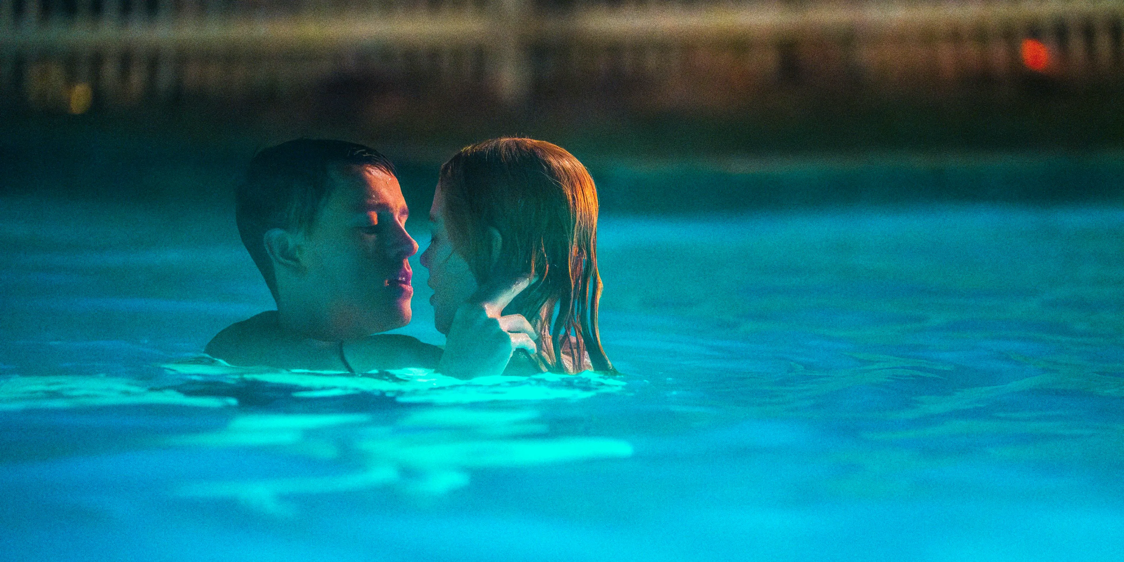 Romy and Samuel embracing in a pool in Babygirl Image