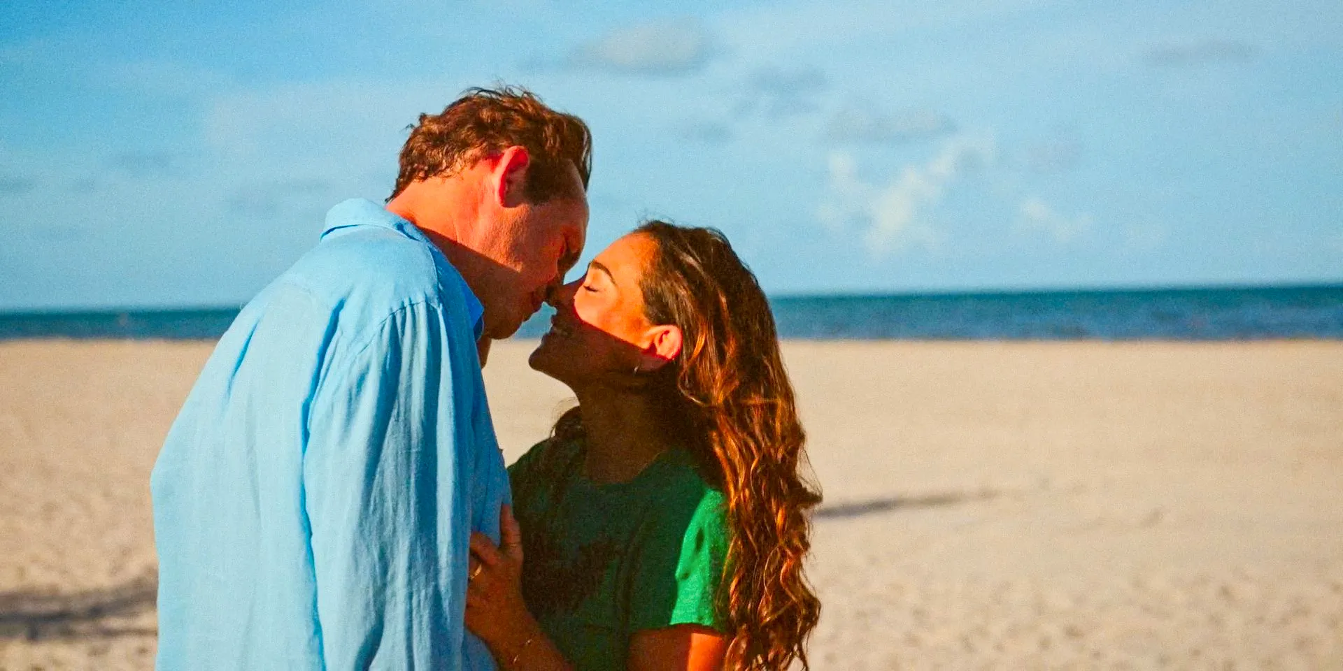 Rosa (Natalie Martinez) and Yancy (Vince Vaughn) are about to kiss on the beach in Bad Monkey Season 1 Episode 9 Image