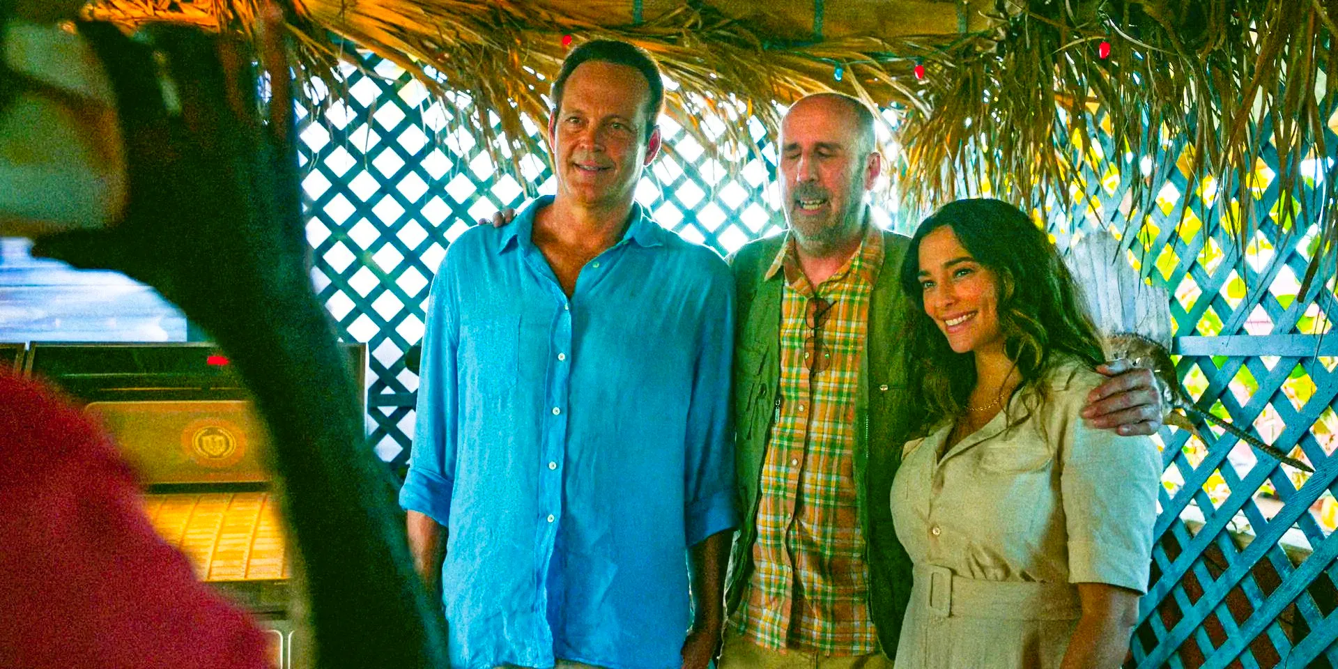 Rosa (Natalie Martinez), K.J. Claspers (Bob Clendenin), and Yancy (Vince Vaughn) taking a photo in Bad Monkey Season 1 Episode 9 Image