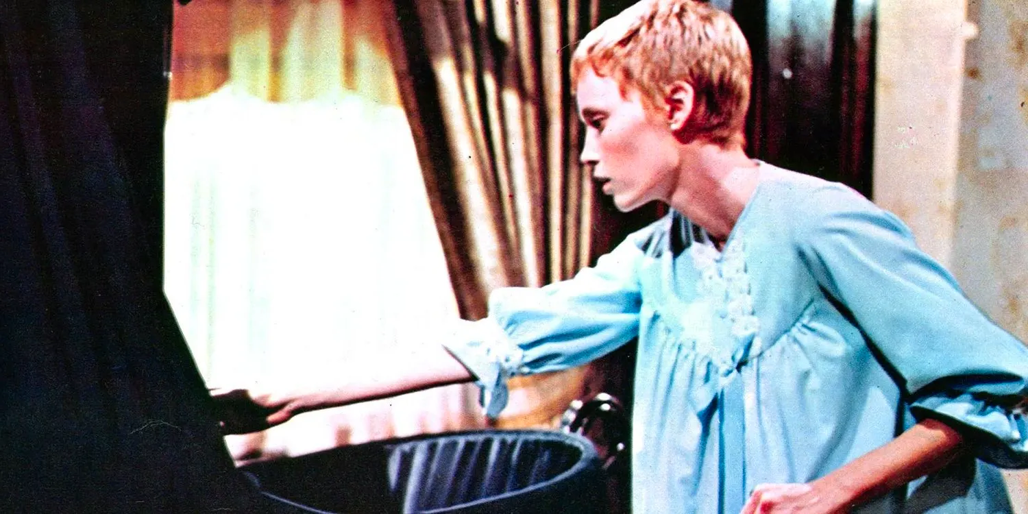 Rosemary looks in the bassinet in Rosemary's Baby. Image