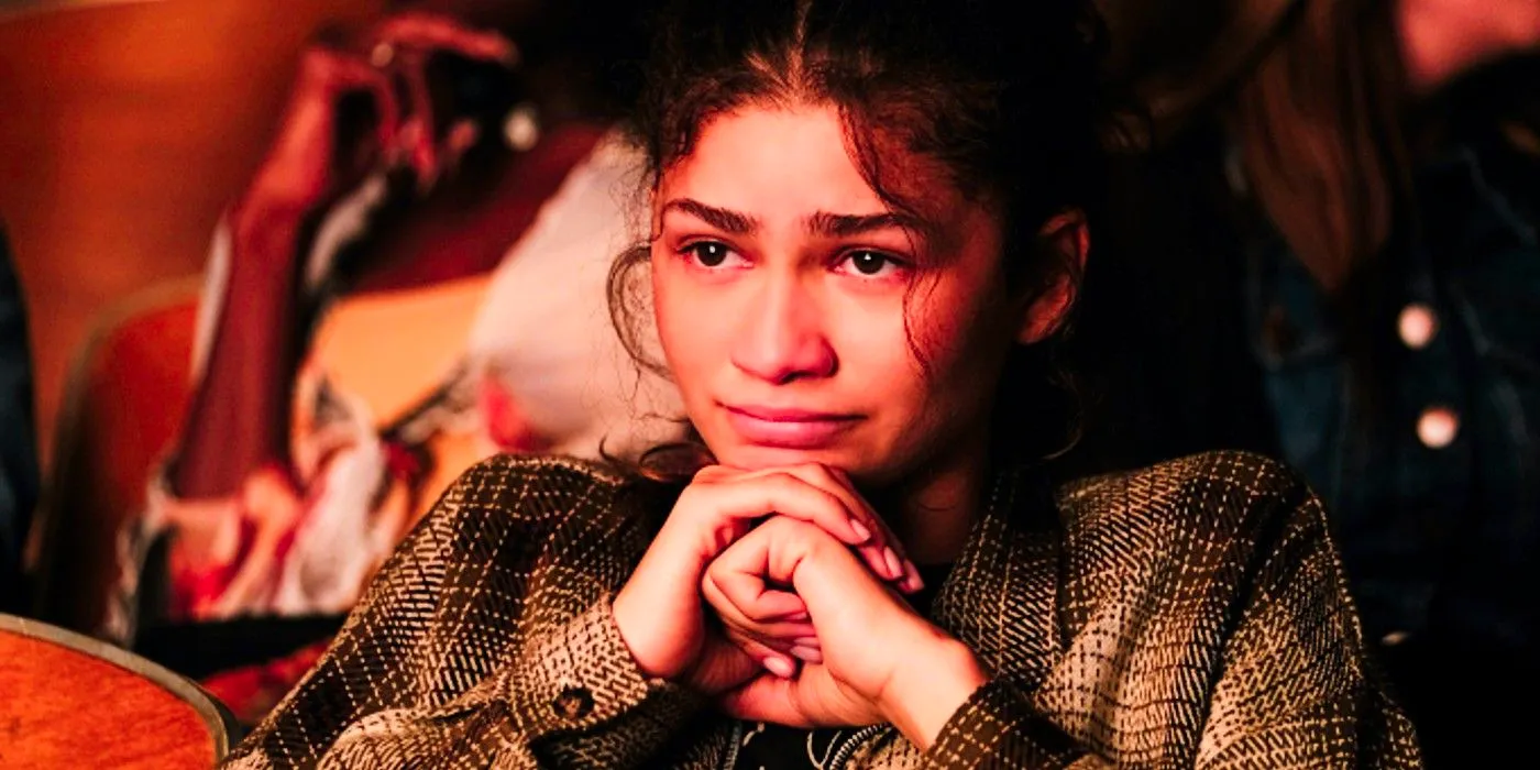 Rue resting her chin on her hands looking sad in Euphoria  Image