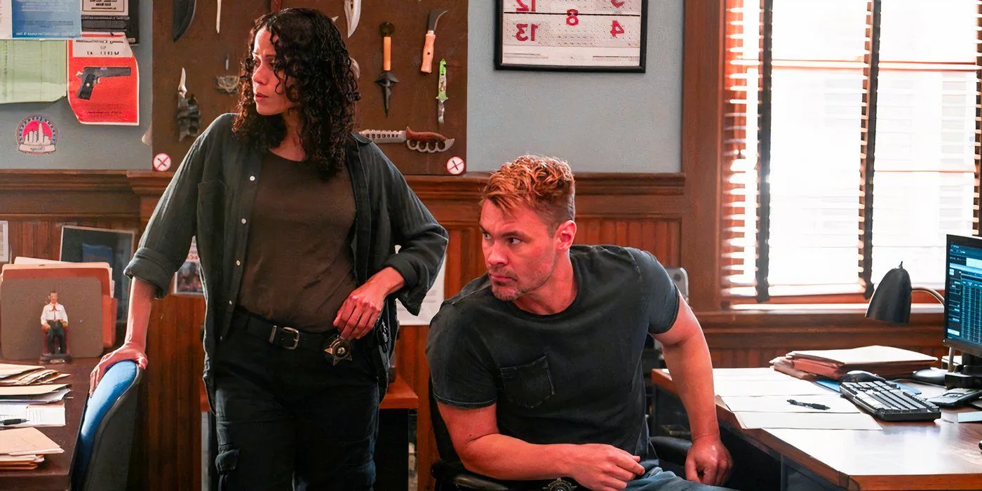 Ruzak and Martel sitting together in the squad room in Chicago PD Season 12 Image