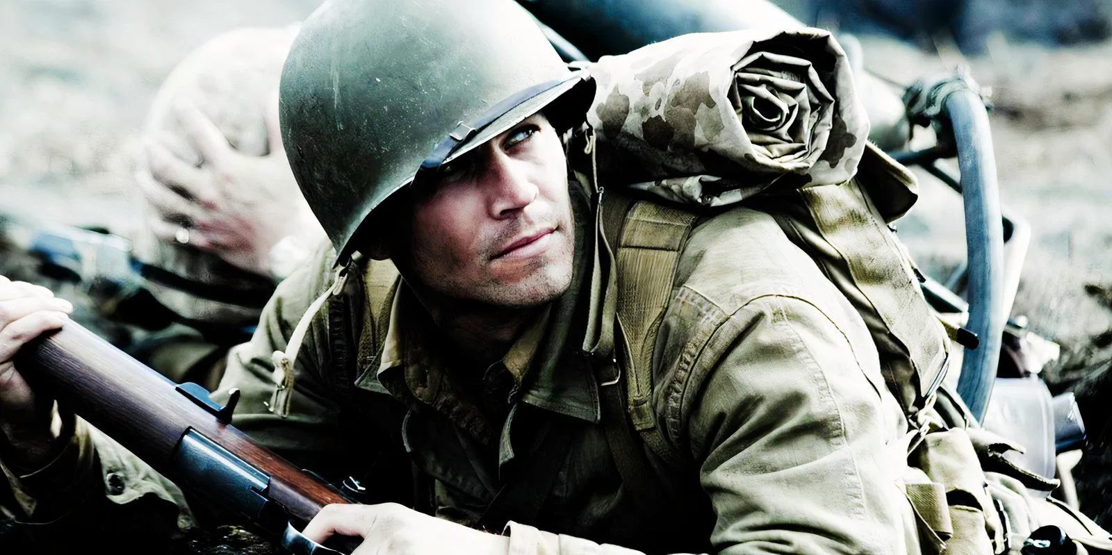 Ryan Phillippe looking over his shoulder as John Doc Bradley in Flags of Our Fathers Image