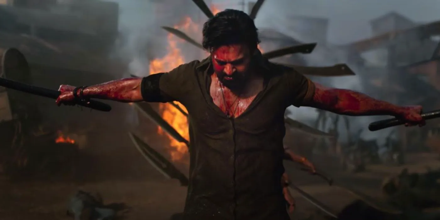 Salaar (Prabhas) holding two swords and flexing in Salaar Part 1 Ceasefire. Image