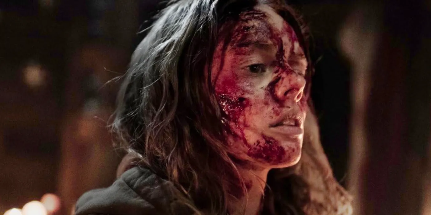 Samara Weaving with blood all over her face in Azrael movie still Image