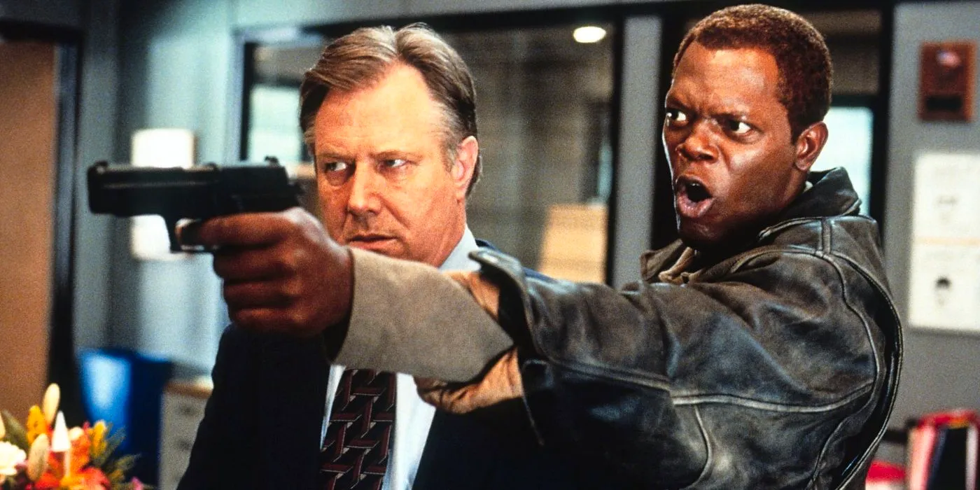 Samuel L. Jackson yelling and holding a gun in The Negotiator. Image