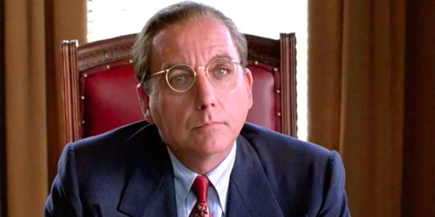 Samuel Norton in Shawshank Redemption, sitting in a red leather chair. Image