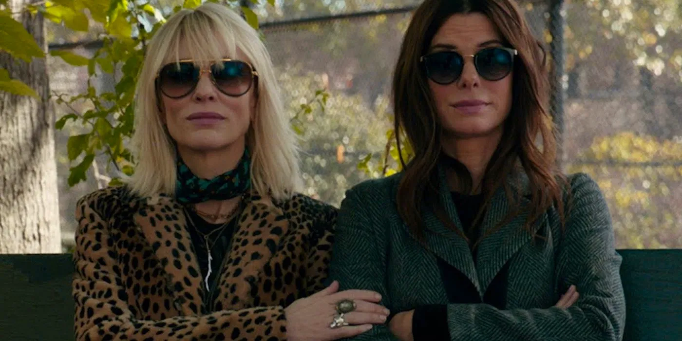 Sandra Bullock and Cate Blanchett standing side by side in Ocean's Eight Image