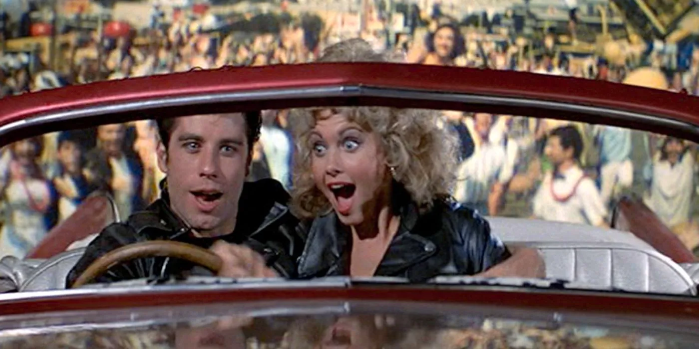 Sandy and Danny in the flying car in Grease. Image