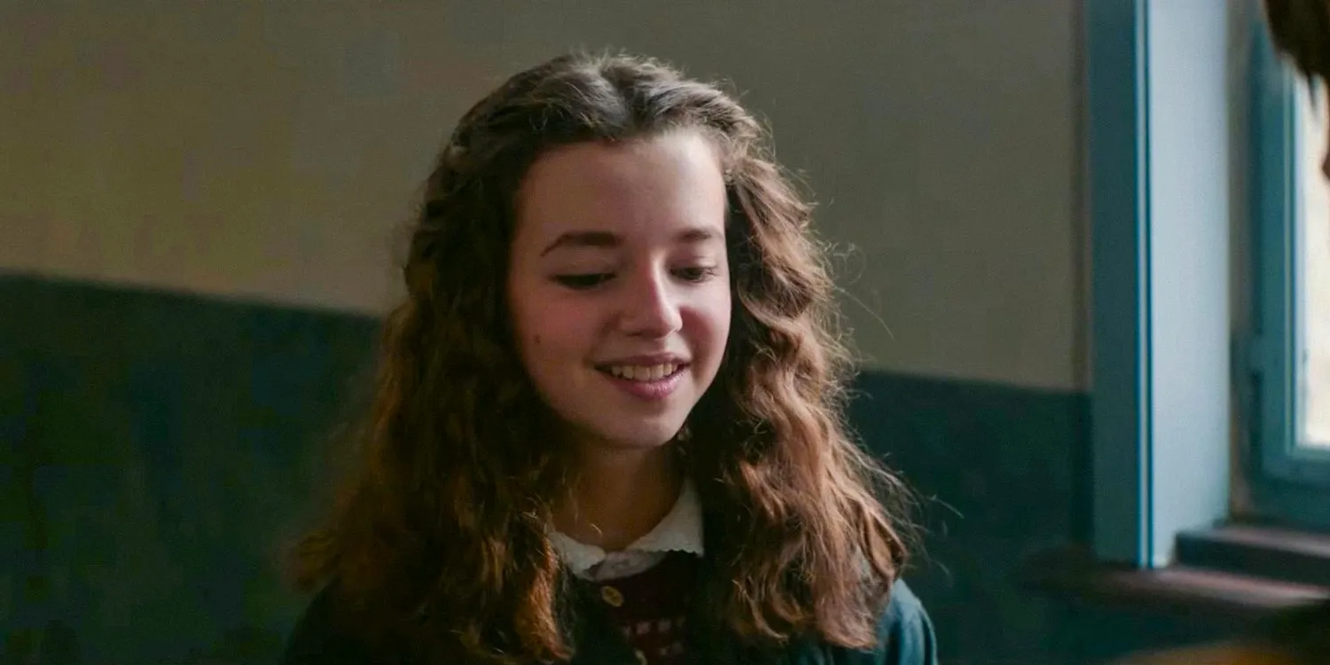 Sara (Ariella Glaser) smiling in White Bird Image