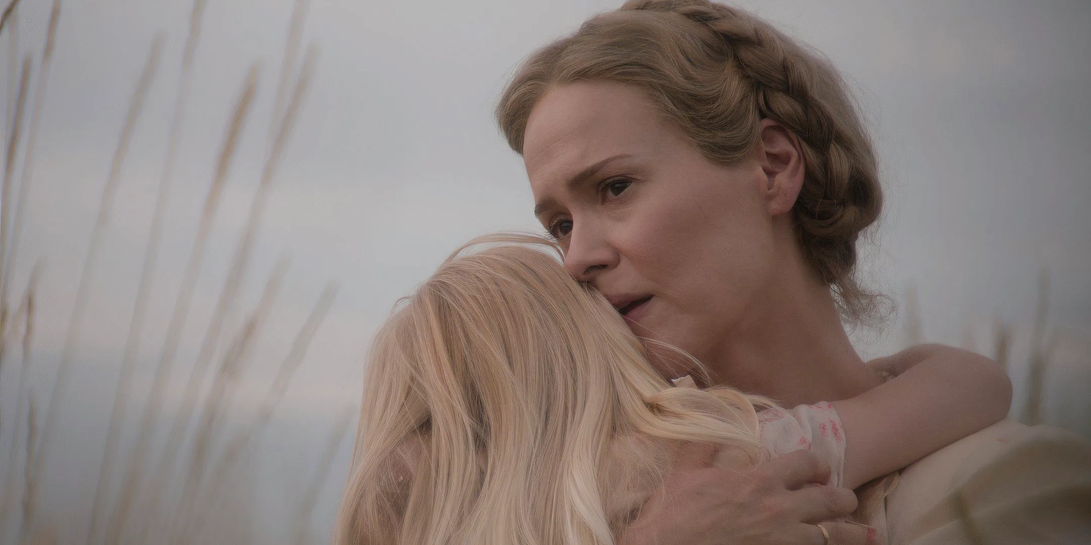 Sarah Paulson as Margaret looking sad while hugging Alona Jane Robbins' Ollie in Hold Your Breath Image