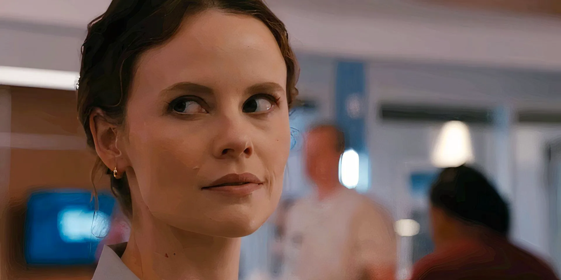 Sarah Ramos as Caitlin Lenox looking over her shoulder in Chicago Med  Image