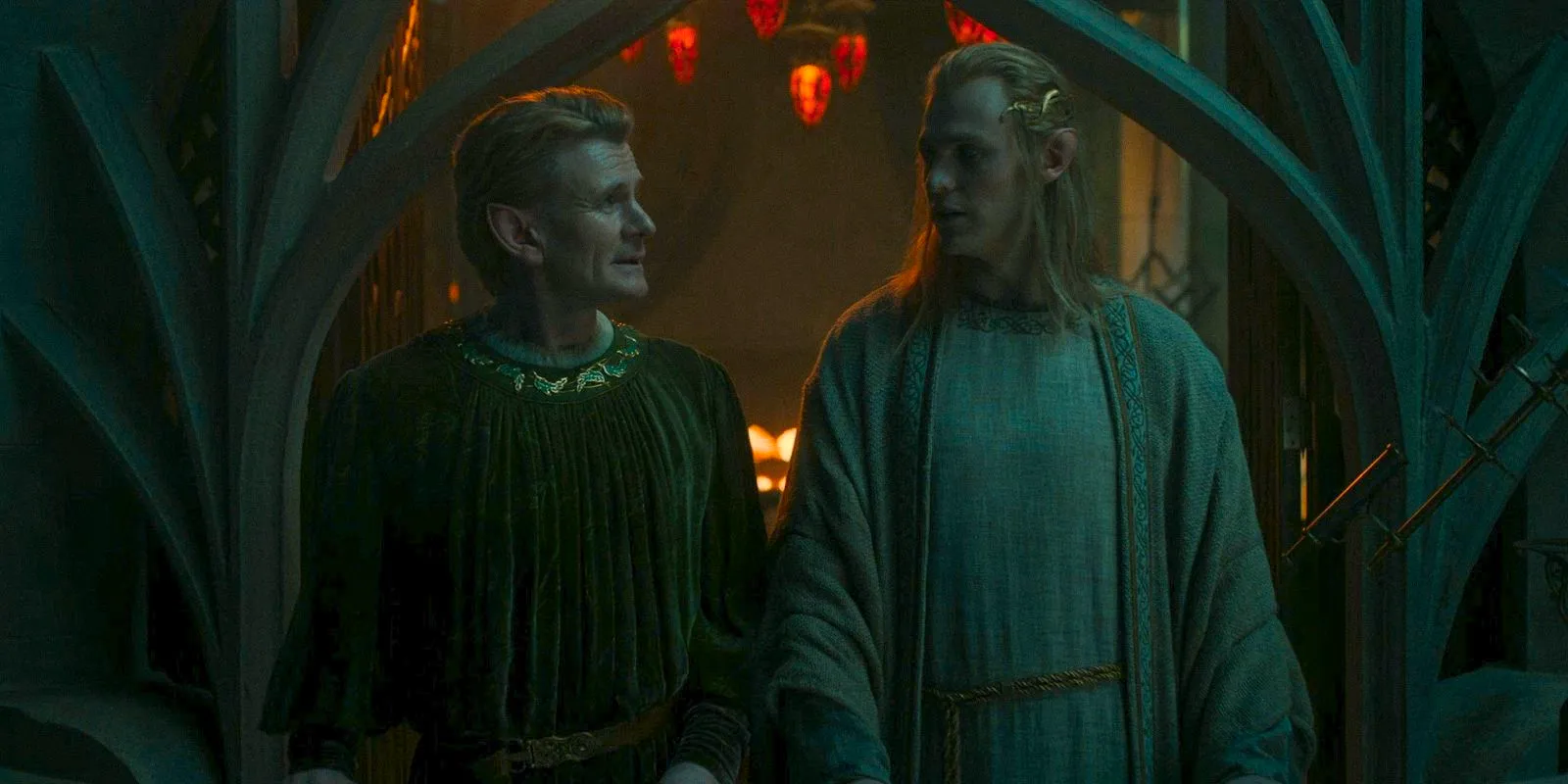 Sauron (Charlie Vickers) and Celebrimbor (Charles Edwards) standing side by side, looking at each other in The Lord of the Rings: The Rings of Power Season 2 Episode 5 Image