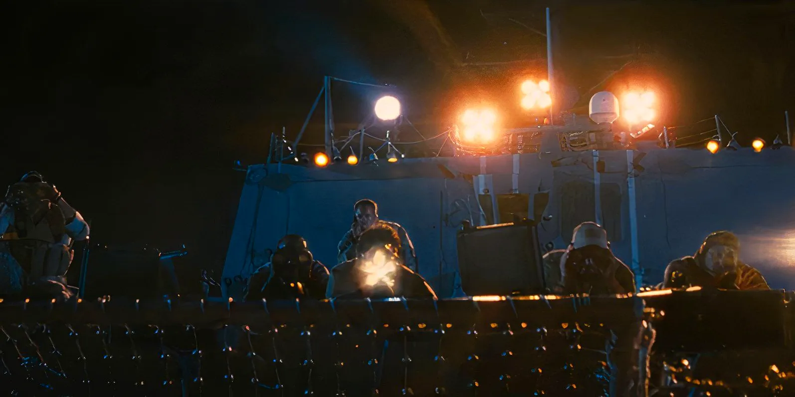 SEAL Team Six fires sniper shots at the Somali pirates in Captain Phillips Image