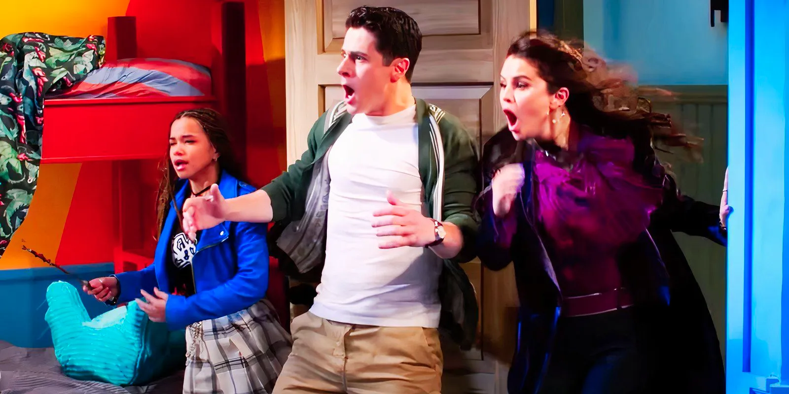 Selena Gomez as Alex Russo David Henrie as Justin Russo and Janice LeAnn Brown as Billie looking shocked in Wizards Beyond Waverly Place Image