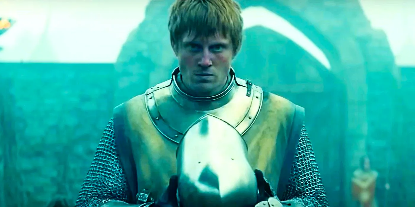 Ser Duncan holding his helmet while staring forward in A Knight of the Seven Kingdoms Image