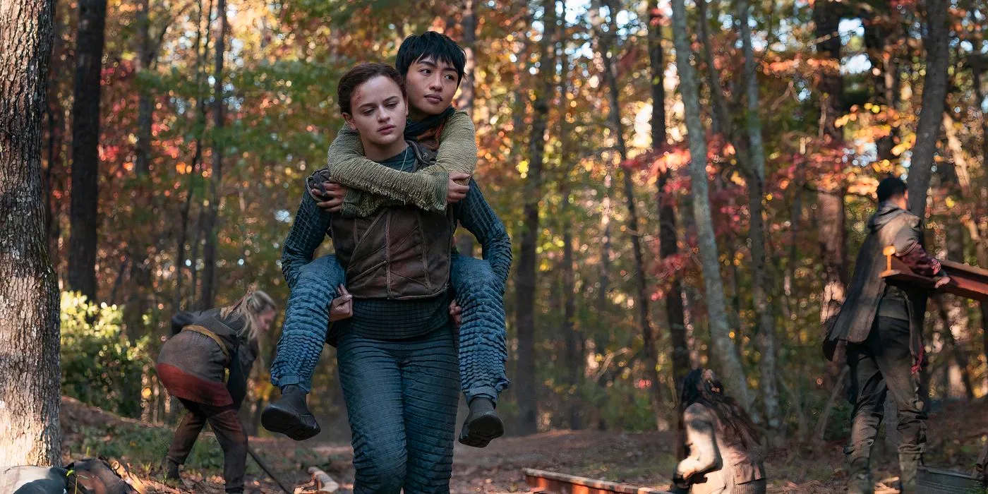 Shay (Brianne Tju) and Tally (Joey King) walking down the train tracks in The Smoke in Uglies Image