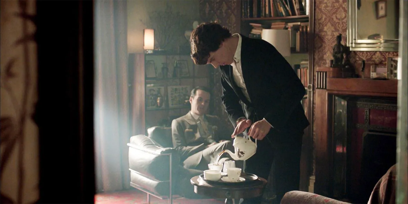 Sherlock (Benedict Cumberbatch) serving tea to Moriarty (Andrew Scott) in Sherlock Image