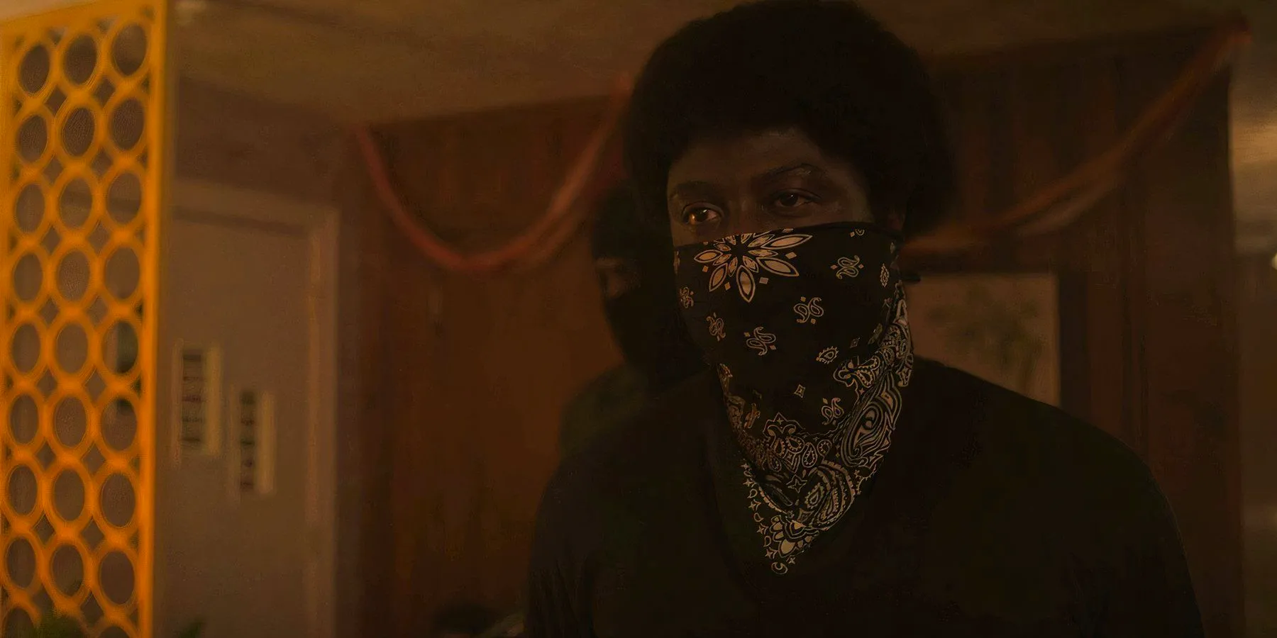 Sinqua Walls as McKinley (Mac) Rogers with a bandana covering his face in Fight Night Image