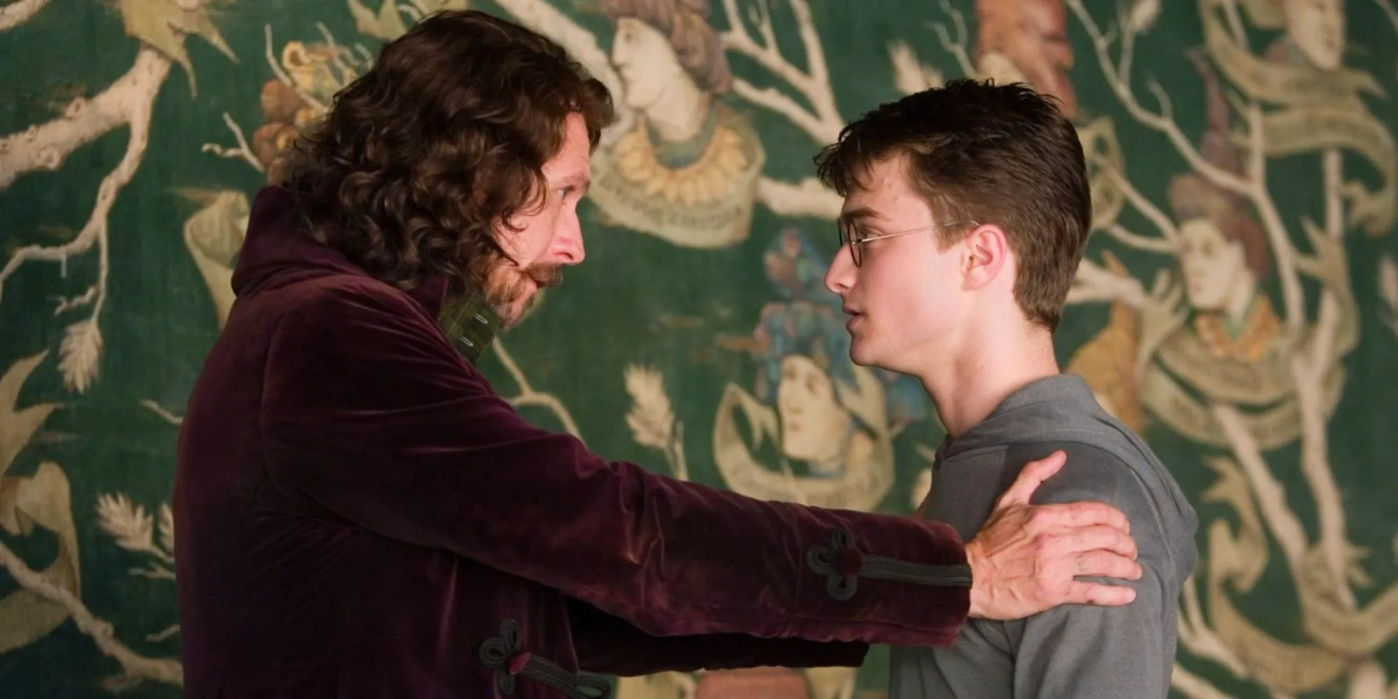 Sirius Black holding Harry Potter's shoulders and giving him a sincere look in Harry Potter and the Order of the Phoenix Image