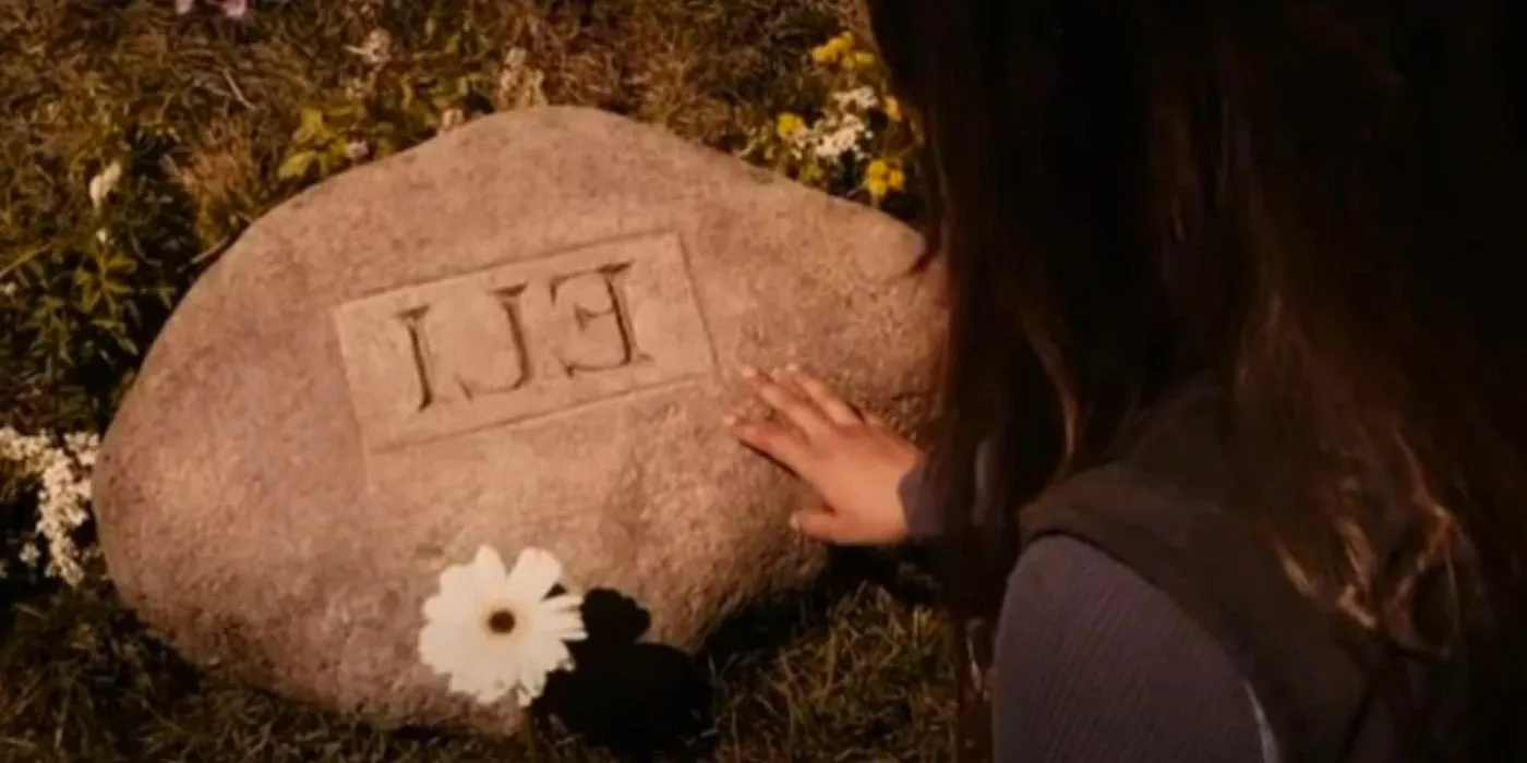 Solara visits Eli's grave in The Book of Eli Image