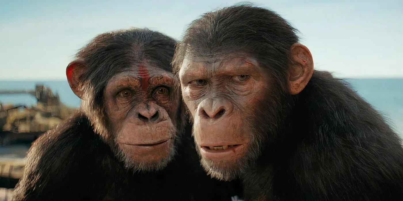 Soona stands behind Noa with red paint on her forehead in Kingdom of the Planet of the Apes Image