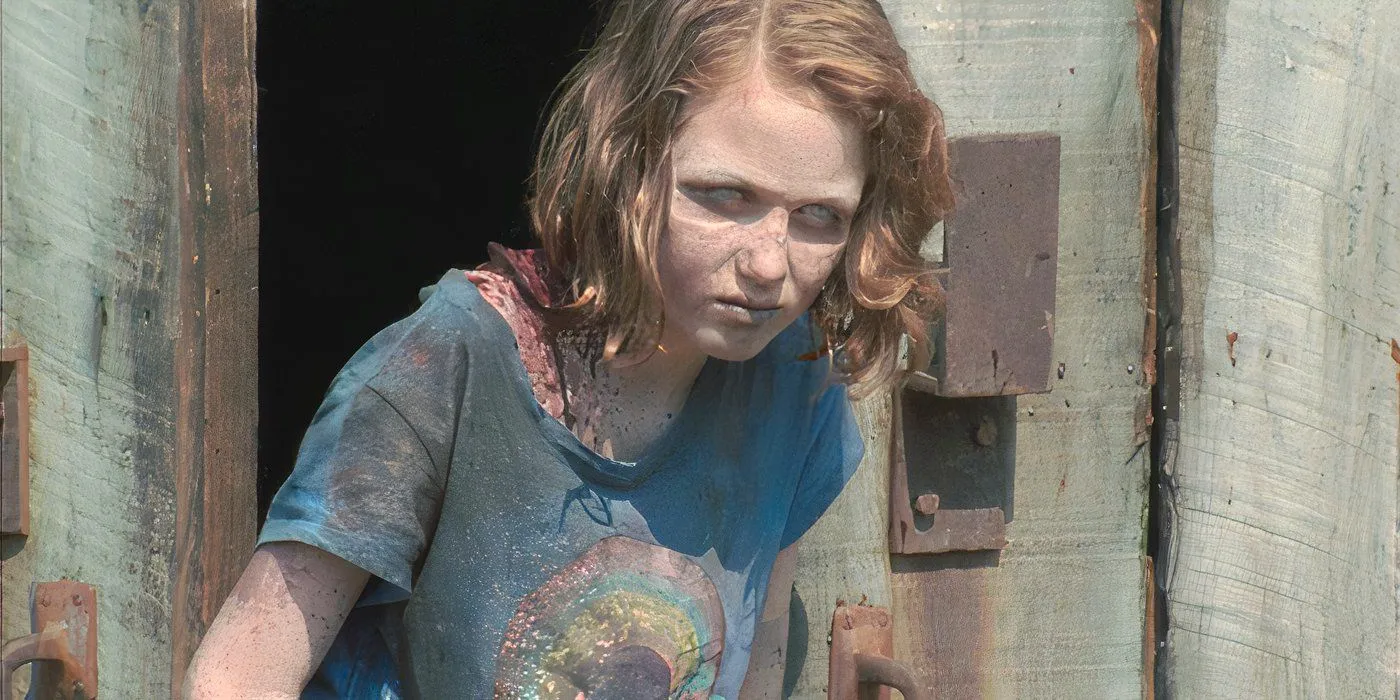 Sophia (Madison Lintz) stumbles out of the barn on The Walking Dead. Image