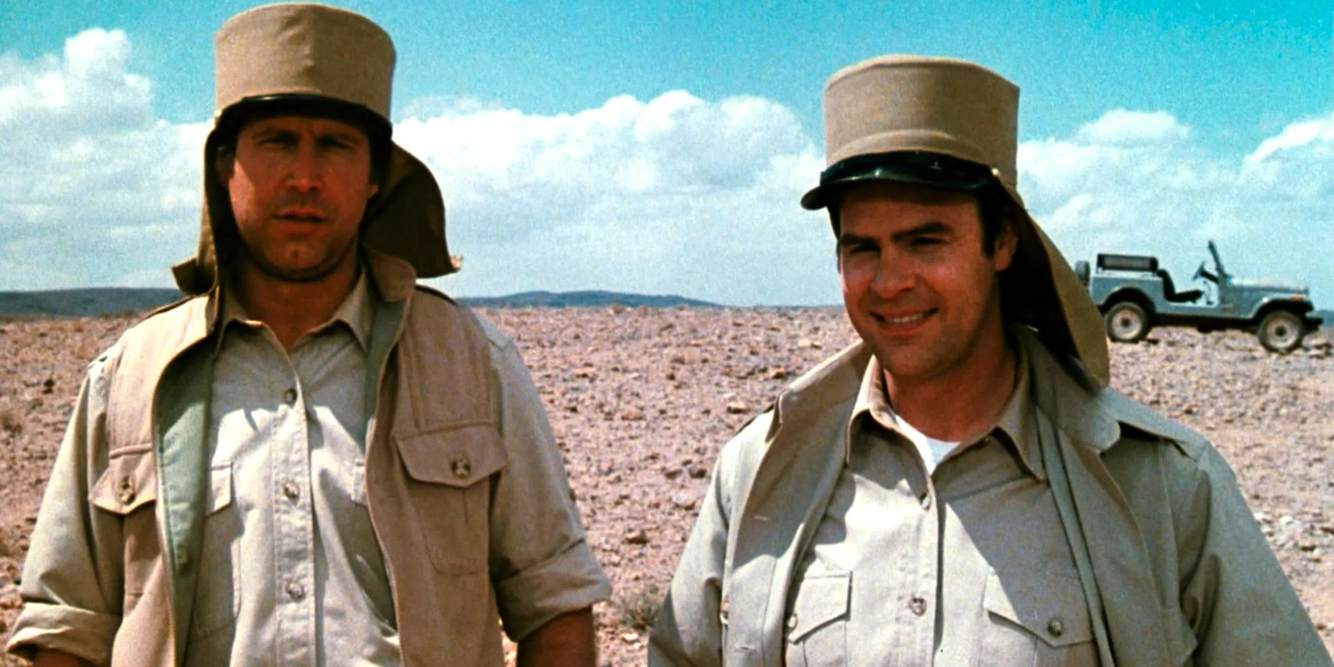 Spies Like Us Dan Aykroyd and Chevy Chase in their military uniforms in a barren landscape  Image